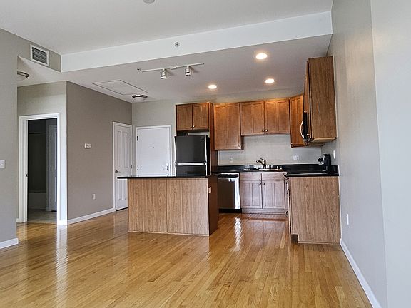 Harwood floors in kitchen & living area