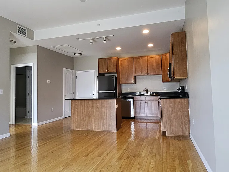 Harwood floors in kitchen & living area