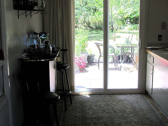 looking through the dining area to the back deck