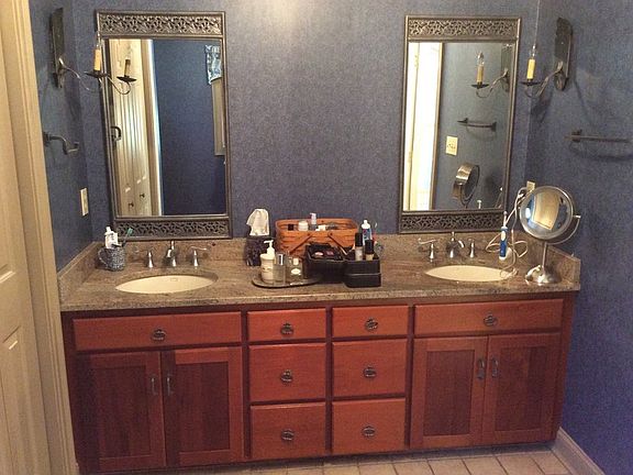 Master bath with granite and mahogany.