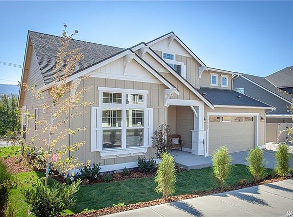 Professional landscaping and sprinkler system on a timer is included.
