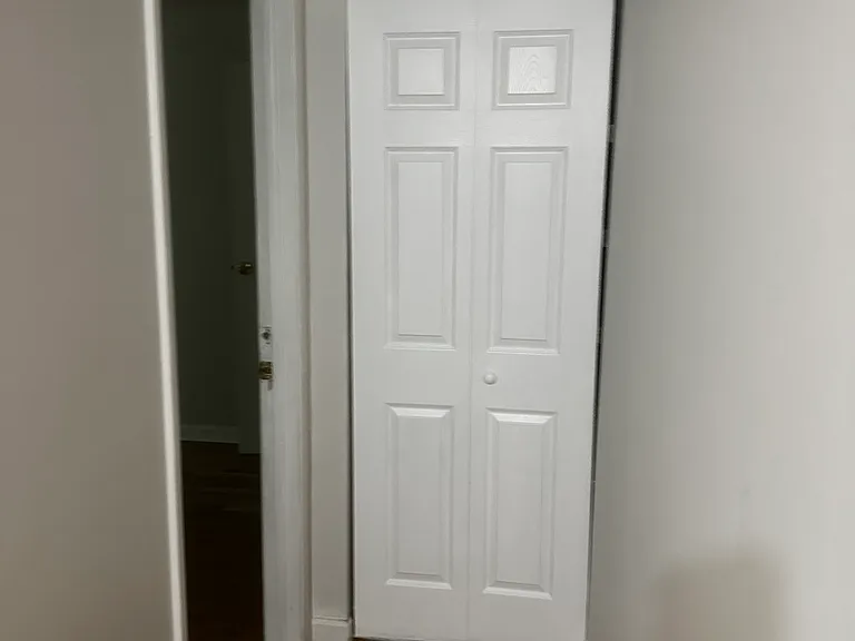 Linen cabinet and entrance to top back room.