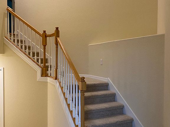 Stairs up to unit - storage closet under stairs