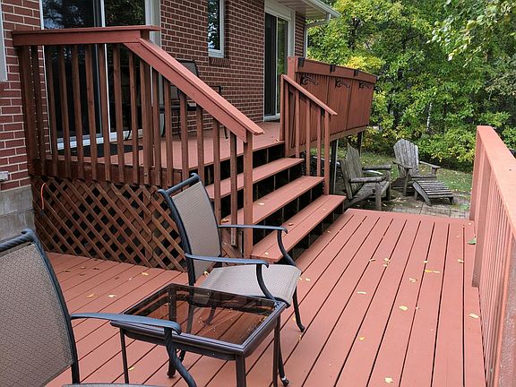 Deck facing lake.  Added adirondeck chairs