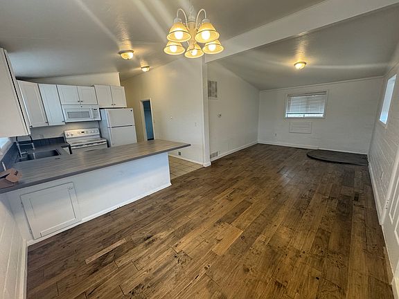Dining room, kitchen, living room view