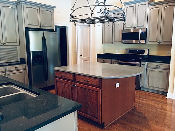 Kitchen w/ island & pot rack
