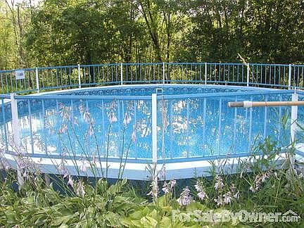 24 foot pool, mid-summer
						:
						4 feet deep; new liner and padding installed 2007.