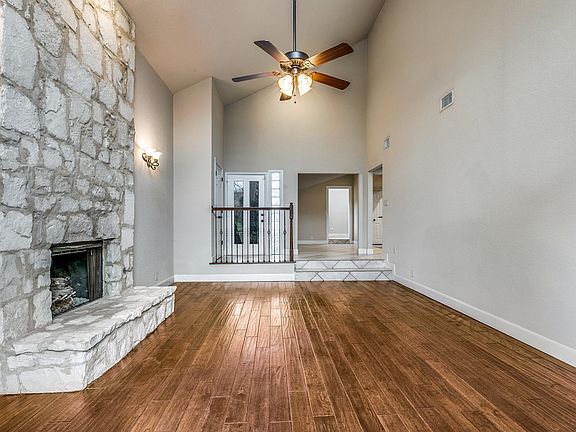 FAMILY ROOM WITH FIREPLACE AND CEILING FAN