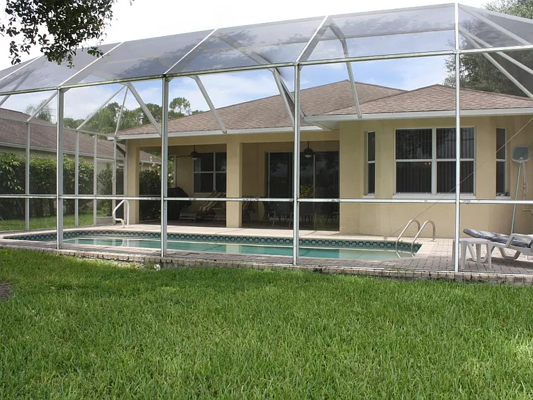 screened outdoor pool with lanai
