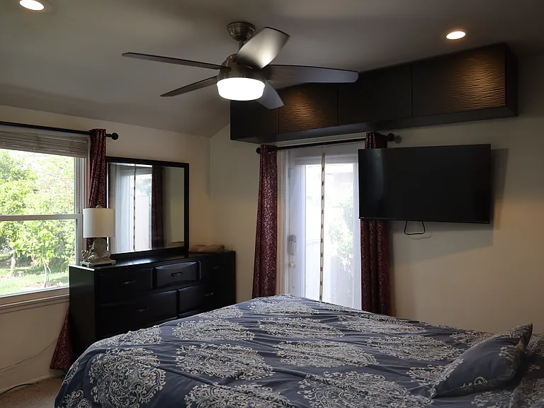 Third bedroom with side yard abd frint yard view