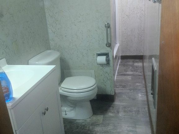 Updated bathroom with new sink, floor and ceiling!!