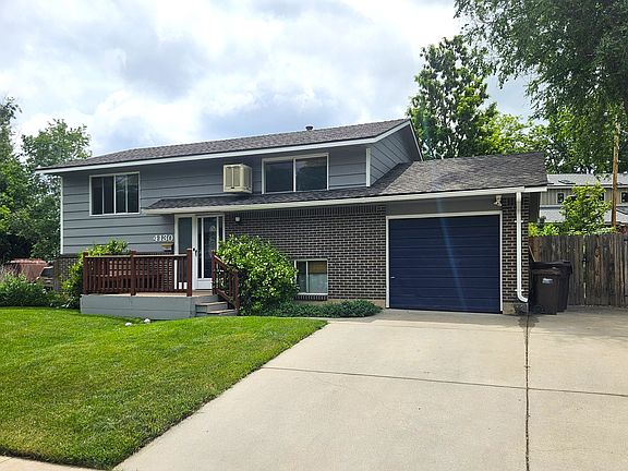 Front of house, one car garage and two parking spaces in driveway