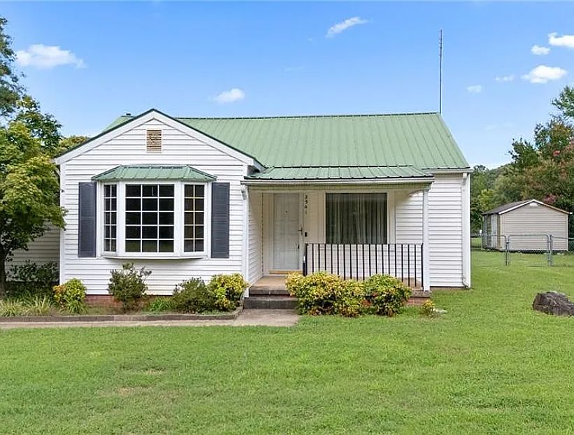 Charming home with flag pole and deep front porch