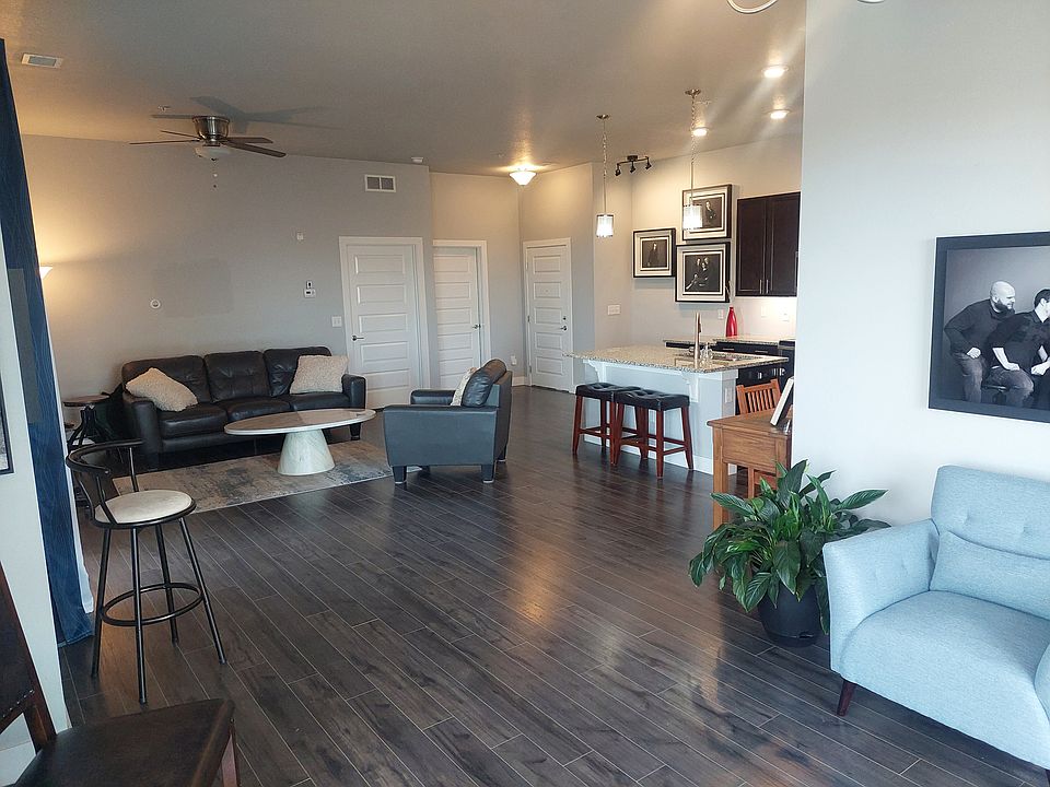 Looking at kitchen and living room from outside door entry way