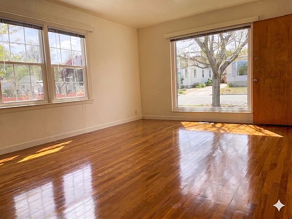 Living room with a view of the quiet street. The windows were just replaced.