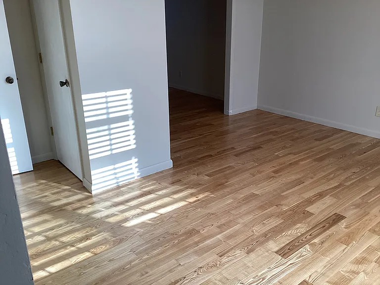 Living room showing door going into half bath