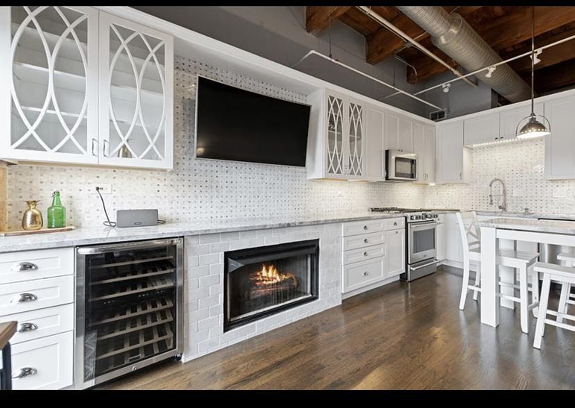 Open kitchen and dining area with tons of storage and shaker cabinets.