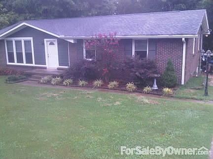 View of home from driveway
						:
						Nice landscaping in front and back of home