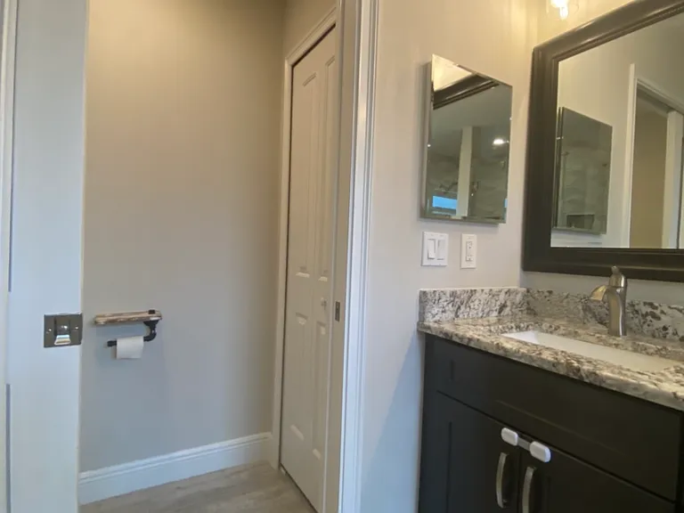 Primary bathroom - toilet room with storage closet