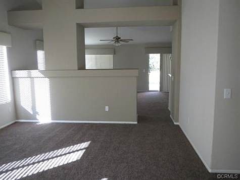 Enter into your living room separated by a peak a boo wall into