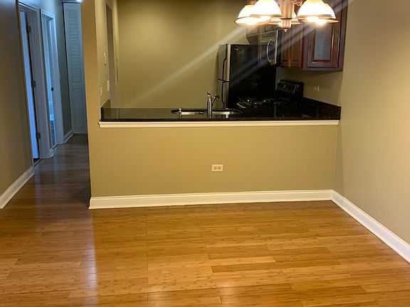 Kitchen opens to dining room and living room.