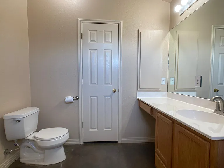 Primary bathroom, opposite view. Door in back to closet.