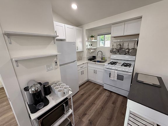 The kitchen has a range, fridge, sink, convection toaster, microwave, coffee maker, and all the things you'll need to make great meals at home.