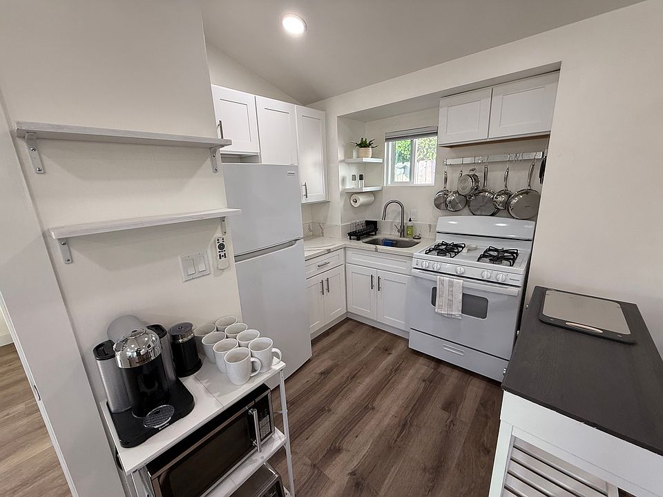 The kitchen has a range, fridge, sink, convection toaster, microwave, coffee maker, and all the things you'll need to make great meals at home.
