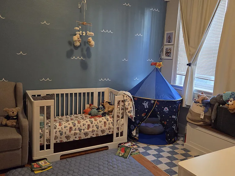 Second bedroom, fits a queen bed. Closet has closet system and extra storage above.