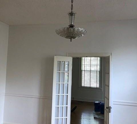 View of the dining room & french doors into the living room