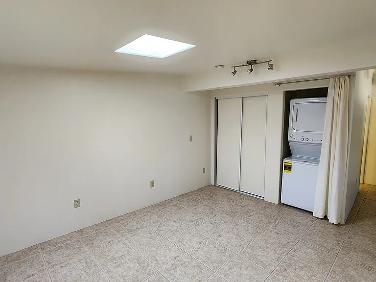 Bedroom with New Stack Washer/Dryer