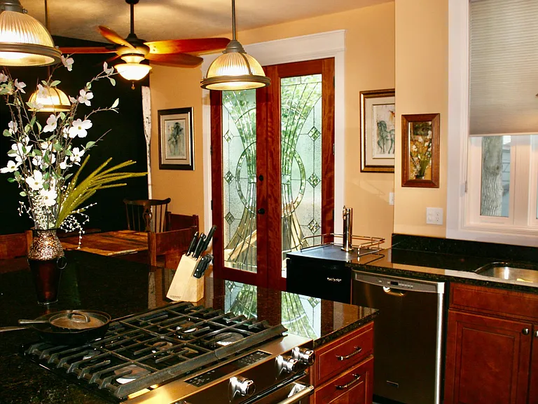 Kitchen French doors to private yard area.