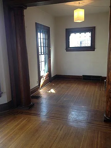 room off living room leading to front porch, stained glass window, oak columns