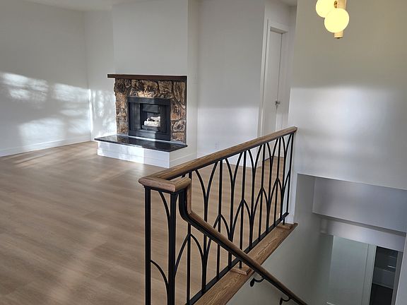 Spacious and bright living room with gas fireplace