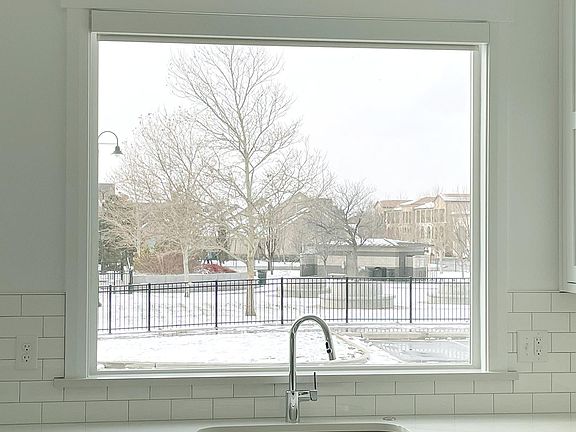 View of park with splash pad from kitchen window.