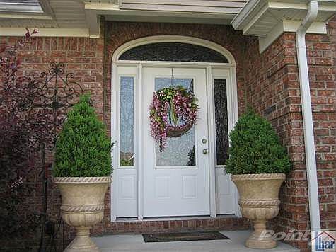 Gorgeous Front Door with wrought iron decorative detailing