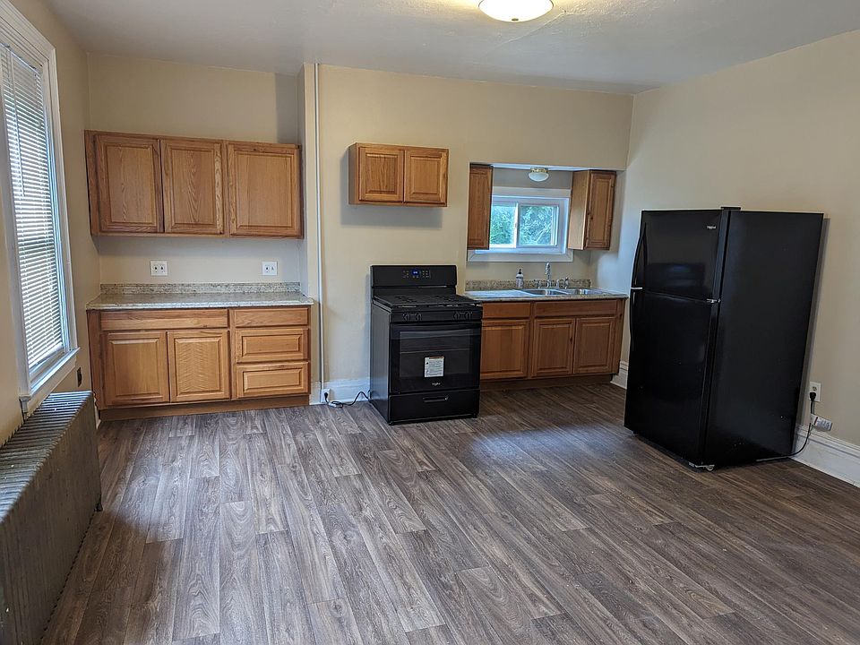 Spacious kitchen with new stove and refrigerator.