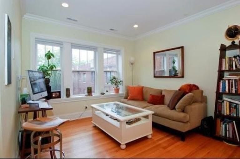 Windows in the living area face out onto the beautiful court