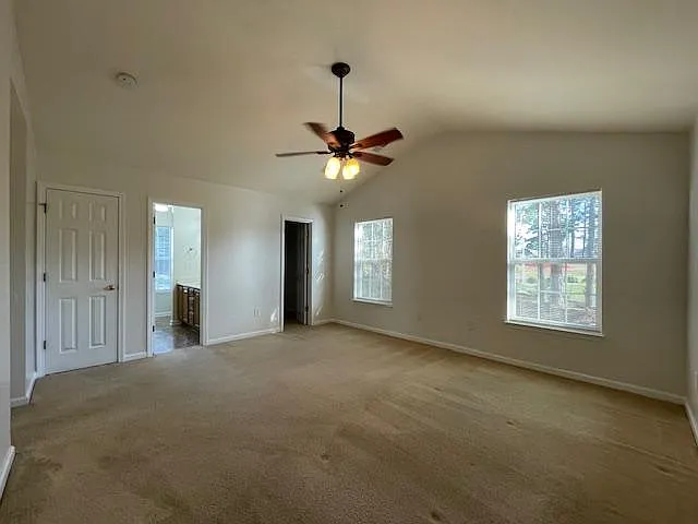 Spacious master bedroom view with linen closet, master ensuite, and walk-in closet.