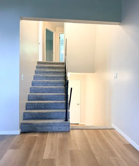 Split entry with stairs leading up to 2 bedrooms, full bath and storage.