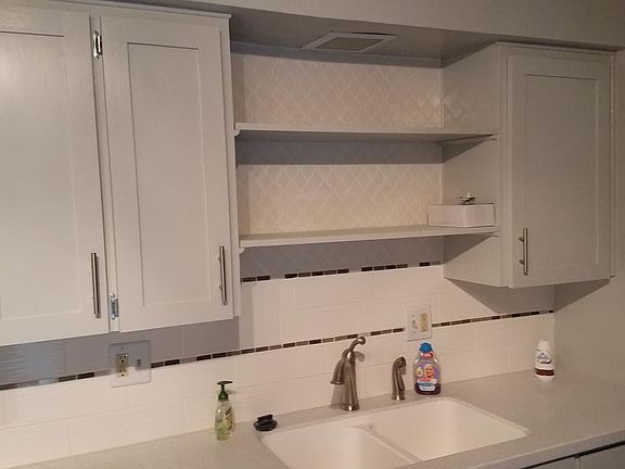 Kitchen has stainless steel appliances