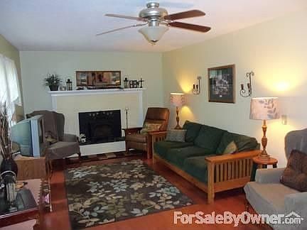 Living Room has Brazilian cherry wood flooring and a fireplace w/ Lopi insert.