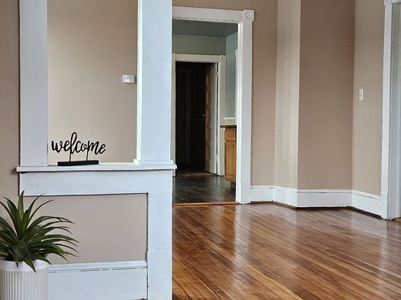 Living Room view into the dining room and kitchen.