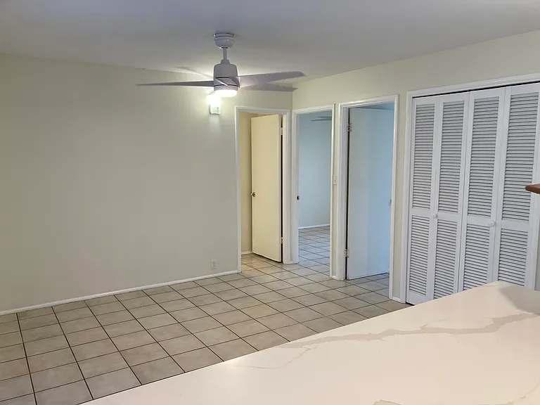 2 bedrooms to the right, 2 large shelved closets right of the bedrooms, the other door is the bathroom.