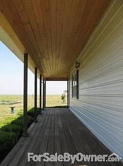 Serene
						:
						The porch offers a beautiful pine ceiling.