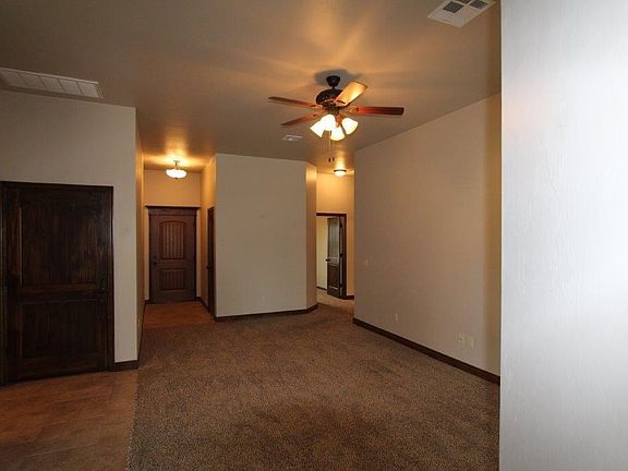 Living area with view of front entry door.