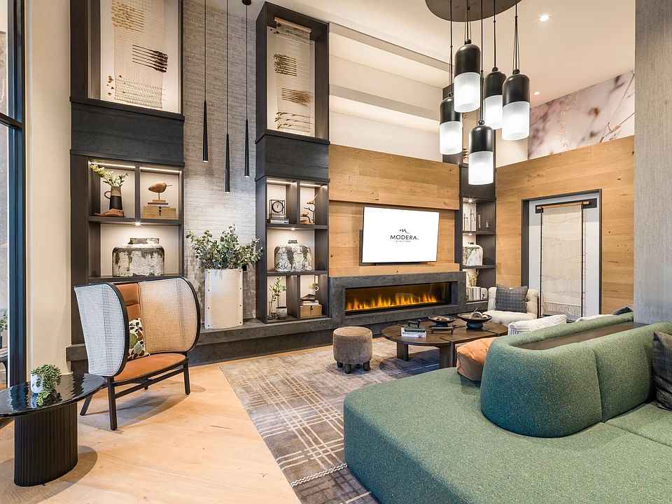 Relax fireside in this cozy and modern resident lounge, perfect for quiet mornings or unwinding with friends.