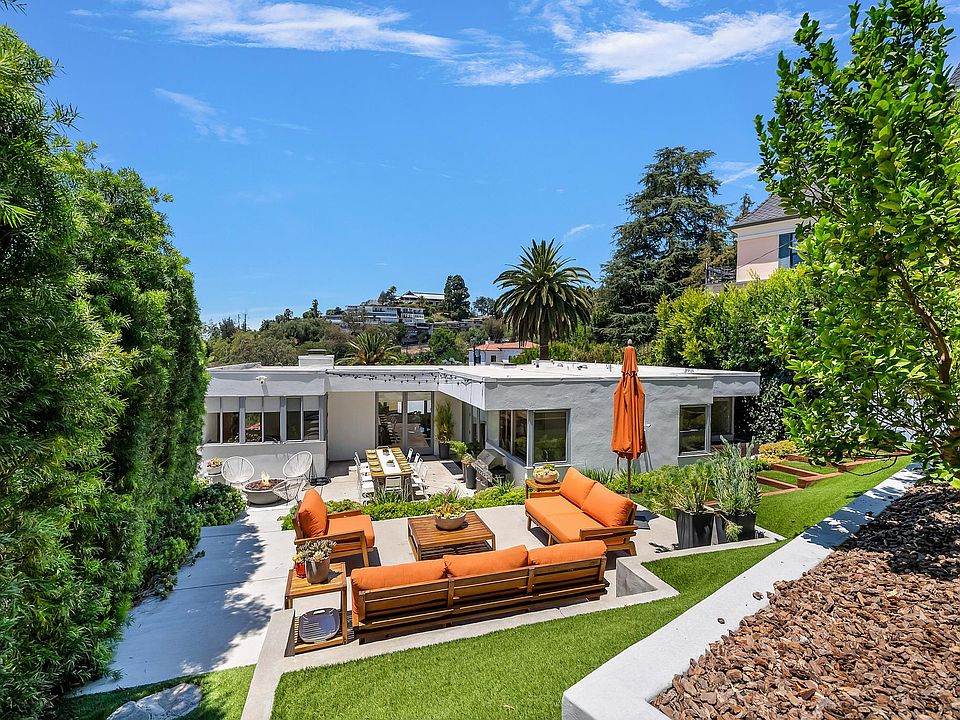 Luxury living in the Hollywood Hills. Large yard with several sitting areas for entertainment and relaxation