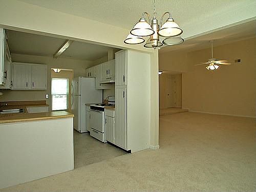 Sunny Breakfast Room looks into Kitchen