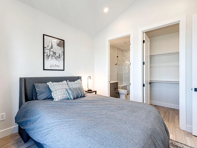 4th bedroom is on the lower level, queen size bed, blackout shades and shared bathroom.